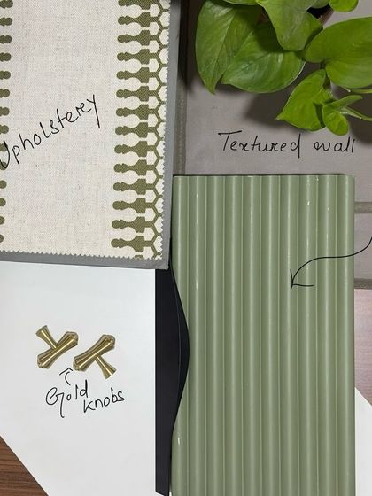 A glimpse into our creative process. This is a moodboard for an upcoming project, combining upholstery fabric, a fluted panel sample, a textured wall finish, and gold knobs to define the material palette. Stay tuned for the render!