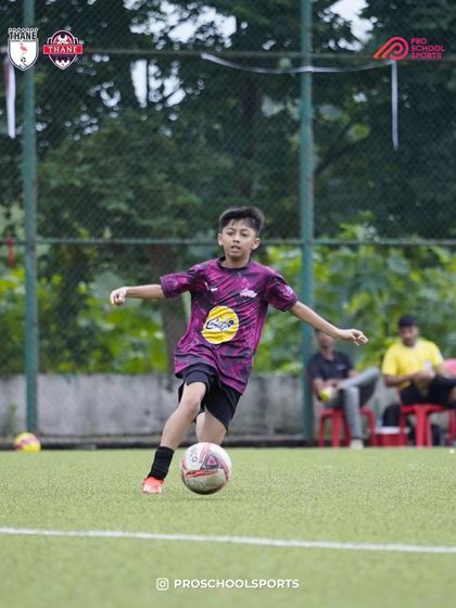 A player dribbles with speed and focus, looking to create an opportunity.