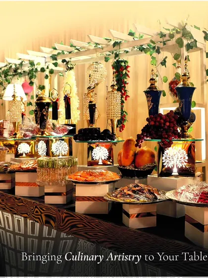 Bringing culinary artistry to your table. This lavishly decorated dessert and fruit station, with crystal accents and a vine-covered trellis, shows our commitment to creating breathtaking displays.