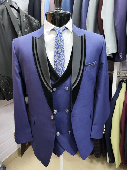 A collection of our designer suits, showcasing a variety of colors, fabrics, and custom details like embroidery, unique lapels, and accessories. Each piece is crafted to make a lasting impression.
