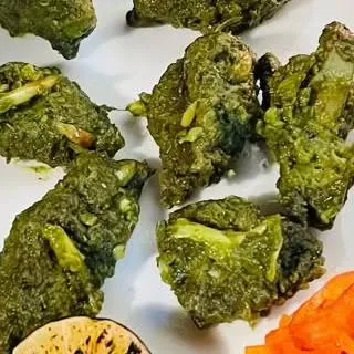 A close-up of the green vegetarian appetizer, highlighting its texture and fresh ingredients.