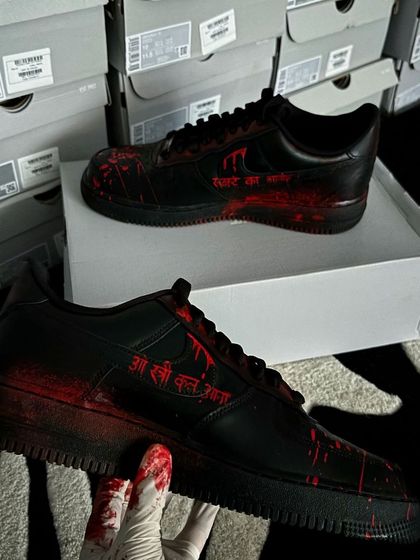 The other side of the "Stree 2" custom sneakers, with the movie's iconic dialogue "O Stree Kal Aana" hand-painted.