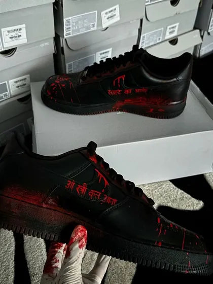 The other side of the "Stree 2" custom sneakers, with the movie's iconic dialogue "O Stree Kal Aana" hand-painted.