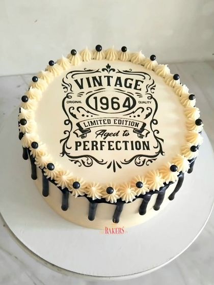 A simple yet elegant cake for a special 60th birthday. The "Limited Edition 1964, Aged to Perfection" design is a charming and witty tribute to a milestone birthday, finished with a classic black chocolate drip.