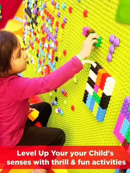 This is our sensory block wall, a favorite among our younger visitors. It's a fantastic tool for developing fine motor skills and creativity, allowing children to build colorful 3D structures and patterns.