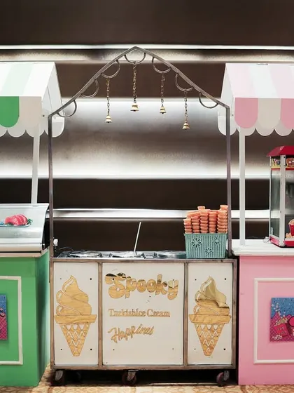 Food stalls are a great addition to any party. Here are custom designed carts for sushi, Turkish ice cream, and popcorn, all matching the party's theme.