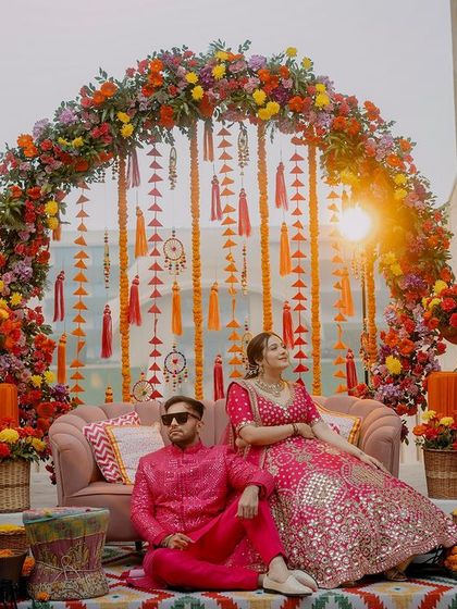 The vibrant and colorful decor of Shashank and Tamanna's Mehendi ceremony. This shot sets the scene, showcasing the festive and lively ambiance of the event.
