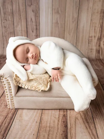 Sleeping peacefully in dreamland. I use simple props like this miniature bench to create a timeless and adorable scene for your newborn.