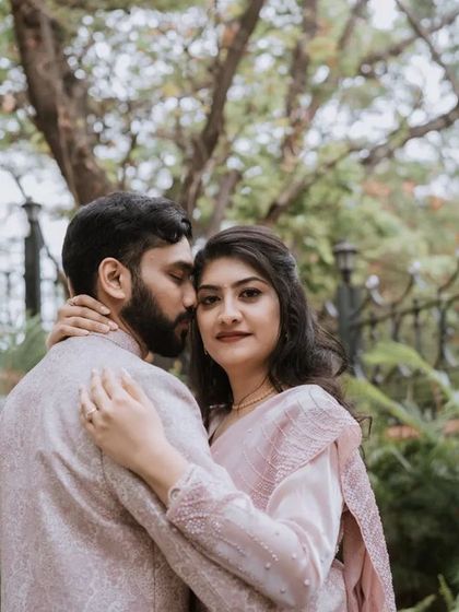 A gentle embrace in a beautiful garden. This photo highlights the couple's quiet connection and the serenity of the moment.