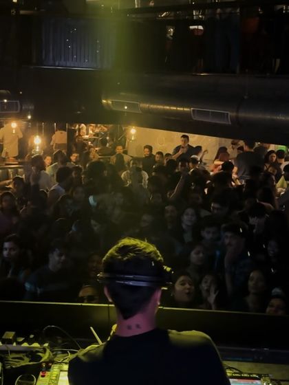 A view from the console of a packed floor. You can feel the anticipation of the crowd as they watch and wait for the next beat.