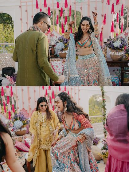Candid moments of the bride dancing and laughing with her family and friends at her Mehendi. These shots are all about the infectious energy and shared happiness.