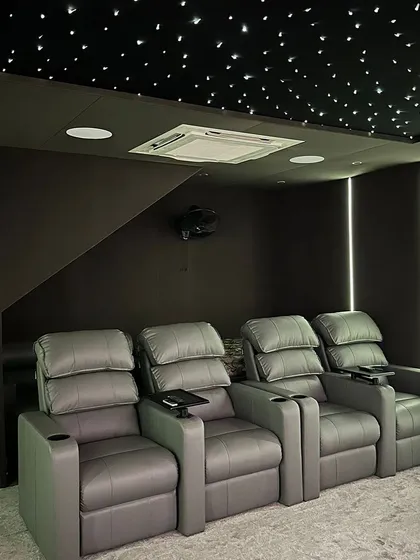 We install premium, ergonomic recliners with built-in cupholders for maximum comfort during long viewing sessions, complemented by a fiber optic star ceiling for a truly magical ambiance.