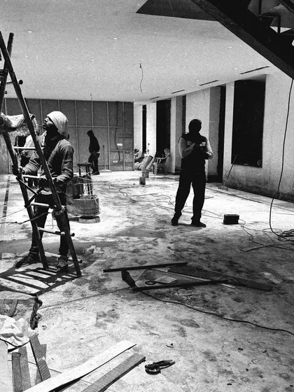 The team at work on site. This image shows the scale of a large residential project during the flooring and finishing stages.