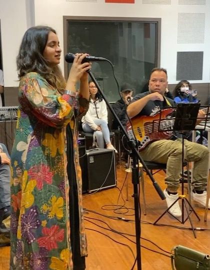 Another shot from our open rehearsal, showing the audience and the band in the same frame. This captures the interactive and collaborative spirit of the session.