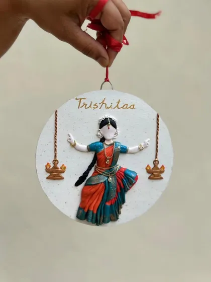 A final look at the dancer wall decor before it was sent out. The red ribbon adds a perfect finishing touch for a gift.
