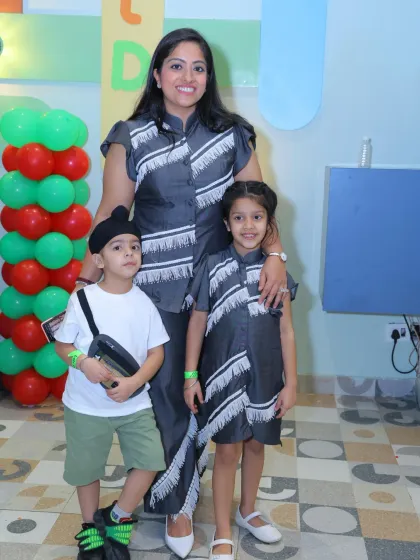 A mother and her children in matching outfits celebrate in style at Wobble World.