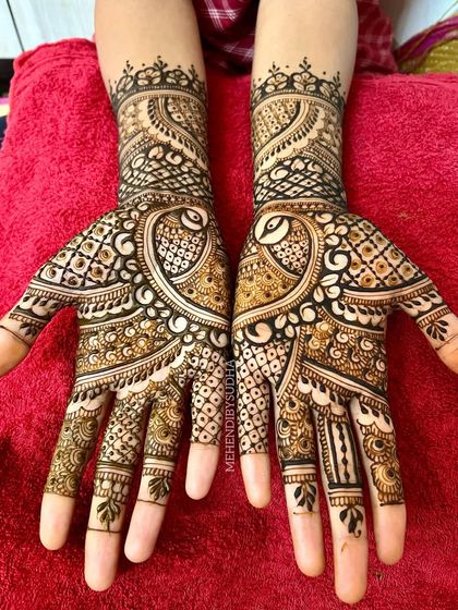 The full symmetrical view of the peacock design, a timeless choice for any wedding guest.