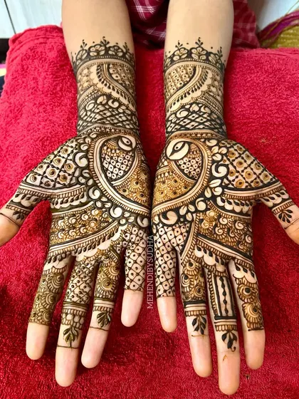 The full symmetrical view of the peacock design, a timeless choice for any wedding guest.