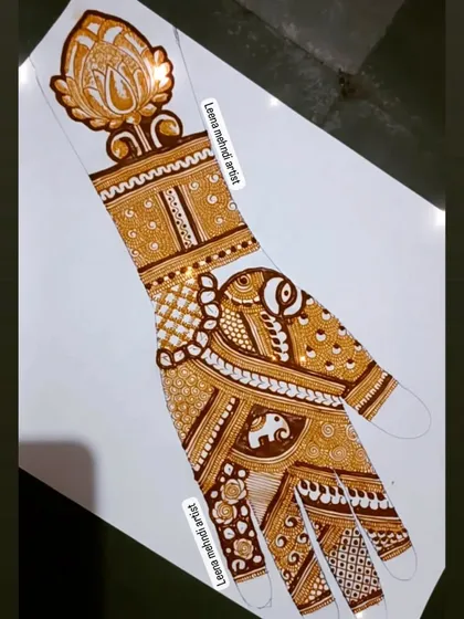 The completed practice design with the lotus cuff, elephant, and peacock motifs.