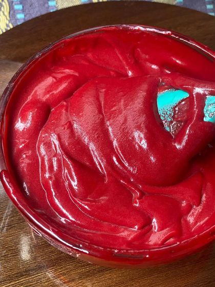 Another shot of the smooth and glossy red velvet batter, ready to be swirled with cheesecake filling. I take great care in preparing my batters to ensure consistent quality.