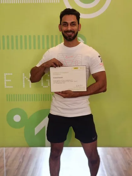 Here I am with my Pilates Level 1 Reformer certification. I integrate Pilates principles into my training to build core strength, improve posture, and help you move pain-free. It's not just about lifting heavy, it's about moving well.