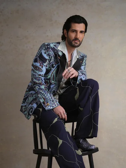 Another angle of the FHM India look, highlighting the interplay between the bold patterns of the tuxedo and the fluid lines of the trousers. It's a look designed for a man who is comfortable making a statement.