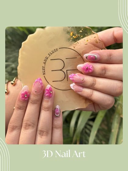 A beautiful example of 3D nail art. This set features vibrant pink sculpted flowers on a sheer, shimmery base, perfect for a tropical vacation.