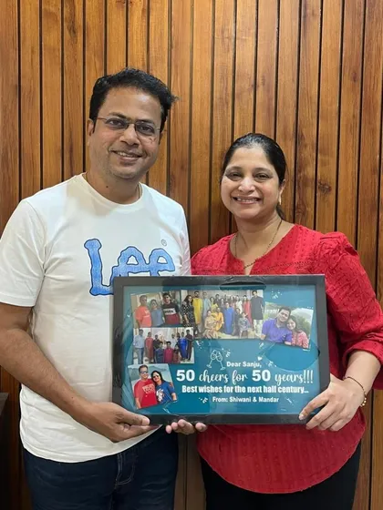 The happy recipients of a custom 50th birthday photo collage frame. Seeing these smiles is the best part of my work.