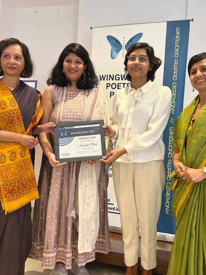 The official award presentation to the 2023 first prize winner, Surabhi Naik.