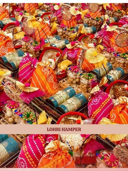 Celebrate Lohri with our vibrant and festive hampers. This image captures the essence of our Lohri collection, featuring colorful bandhani potlis filled with traditional treats like popcorn and gajak.
