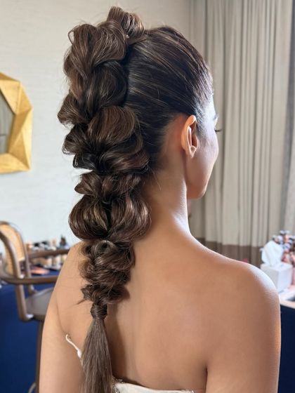 A detailed shot of the pull-through braid, highlighting its volume and structure.