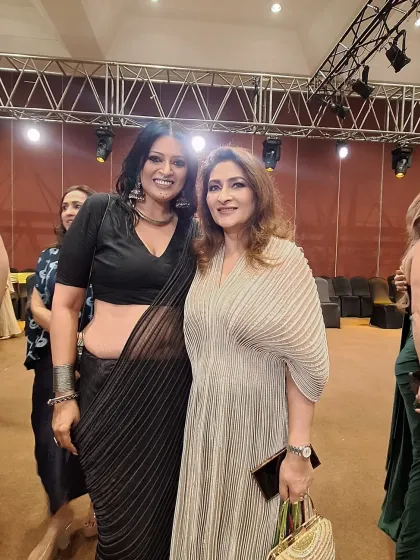 With a guest at the Vaishali S. handloom showcase. The beauty of a black saree is its versatility; it can be styled to be classic, edgy, or glamorous.