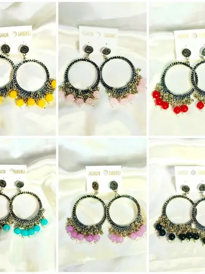 This collage showcases more of our oxidized silver-finish earring bezels with colorful bead accents. These are great for creating bohemian or traditional-style jewelry pieces.