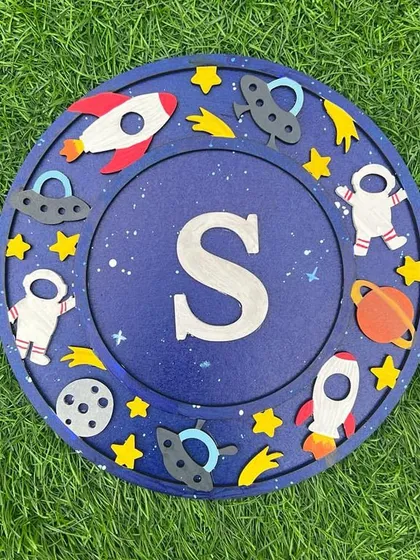 This "S" monogram is out of this world! The deep blue background and colorful space elements make it a visually stunning piece.