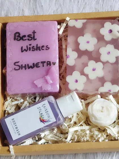 A lovely lavender-themed gift hamper with a personalized "Best Wishes Shweta" soap, body wash, and a small candle.