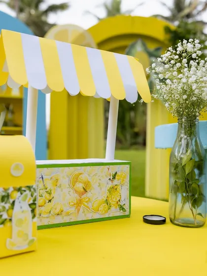 A miniature lemonade stand prop, a cute detail for the dessert table.