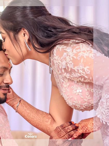 A tender forehead kiss, beautifully composed with a creative editing style.