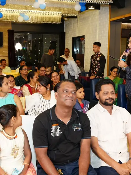 Interacting with the audience at a social gathering. I make it a point to connect with guests, not just stay on the stage.