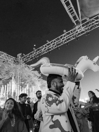 A candid moment capturing the pure joy and uninhibited fun of the night. My goal is to create environments where guests feel free to celebrate and make memories.