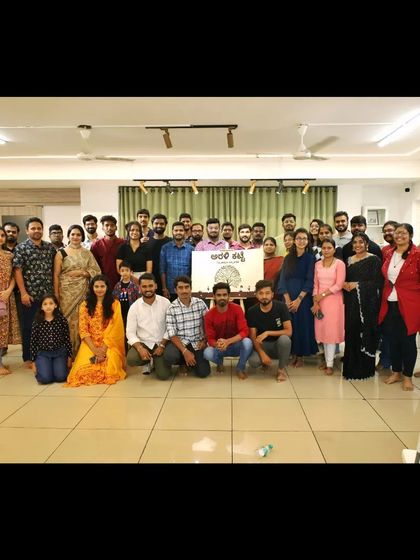 The community gathers for a group photo after a fulfilling evening of Kannada art.