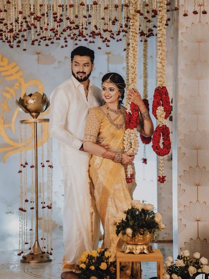 A collection of moments from bride Ishwarya's Muhurtham. Her golden wedding saree was draped to be both photogenic and practical for the various ceremonies of a traditional South Indian wedding.