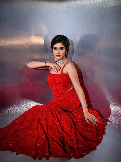 Another artistic shot of the red gown look, demonstrating how to pose models for portfolio shoots.