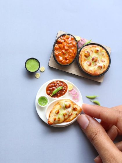 A pair of naan and channa miniatures, perfect for a foodie couple.