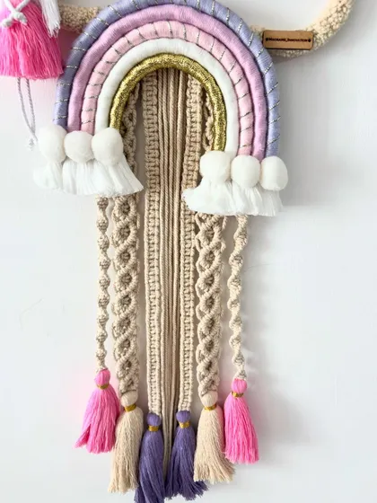 A close-up of the intricate tassels and knots on the 'Mitanshi' name hanging, showing the detailed craftsmanship.