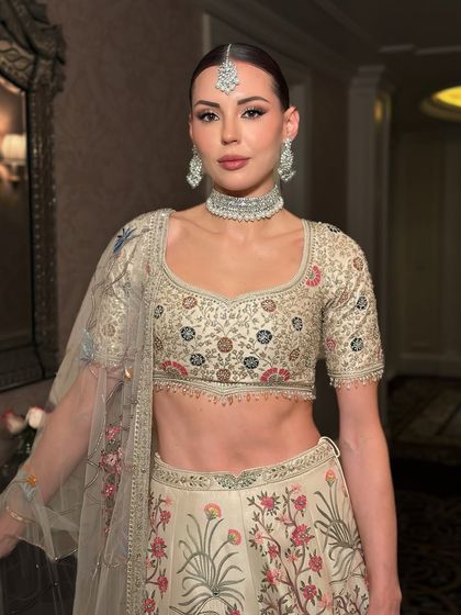 Bringing a vision of couture glam to life on this exotic beauty. Dressed in Anita Dongre, her makeup is sculpted to perfection with luminous skin for a high-fashion, cover-worthy look.