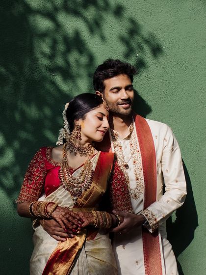 An intimate close-up, with the couple's foreheads touching. The soft light and genuine smiles make this a powerfully romantic and authentic moment.