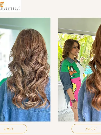 Another view of the beautiful balayage and waves, showing how the client's reflection captures the full effect of the style.