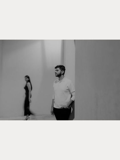 A motion-blur black and white photograph capturing a fleeting moment between the couple in Qatar. This artistic technique adds a sense of story and movement.