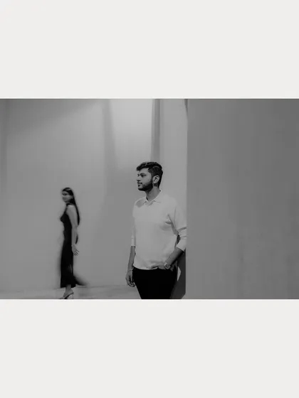 A motion-blur black and white photograph capturing a fleeting moment between the couple in Qatar. This artistic technique adds a sense of story and movement.