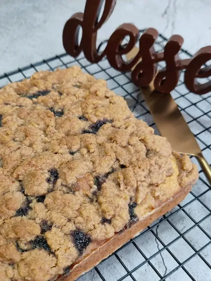 Our Blueberry Crumble cake is perfect for Bangalore's weather. A soft, moist cake is topped with a generous layer of blueberry compote and a buttery crumble topping.